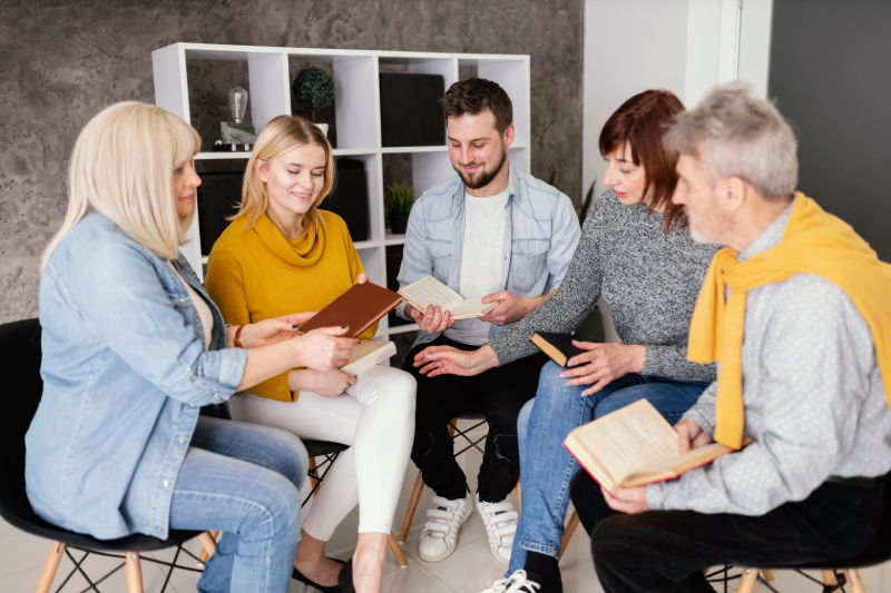 group-people-reading-books-therapy-session group-people-reading-books-therapy-session